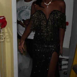 A black and gold sparkly dress